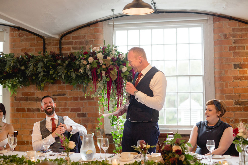 documentary photography of the best mans speech in old mill venue